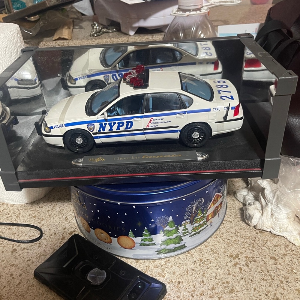 Police Diecast Model Car with Blue and White Colors